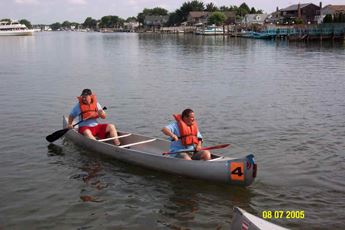 Racers in their boat